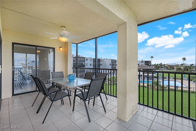 exterior space featuring ceiling fan