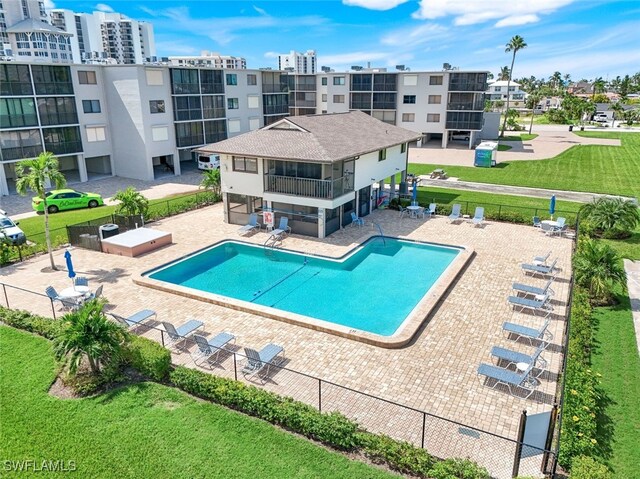 view of swimming pool with a lawn and a patio area