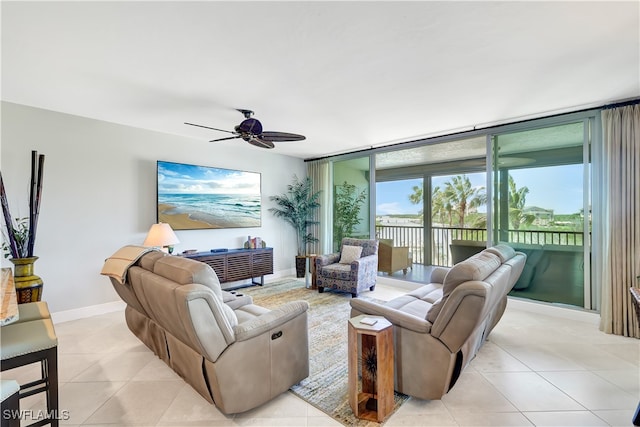 living room featuring ceiling fan and light tile patterned floors