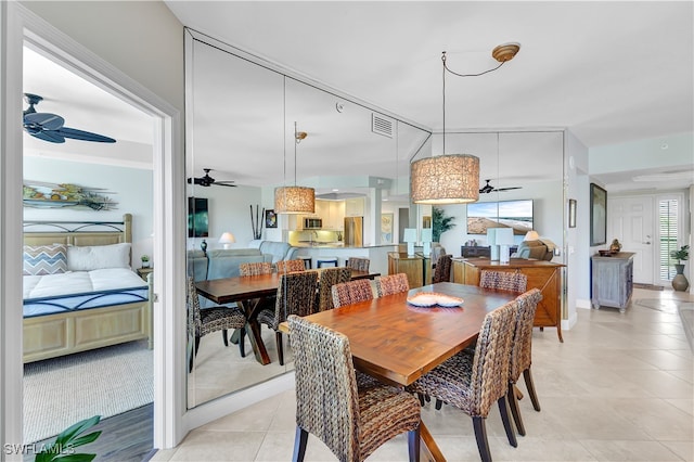 tiled dining room featuring ceiling fan