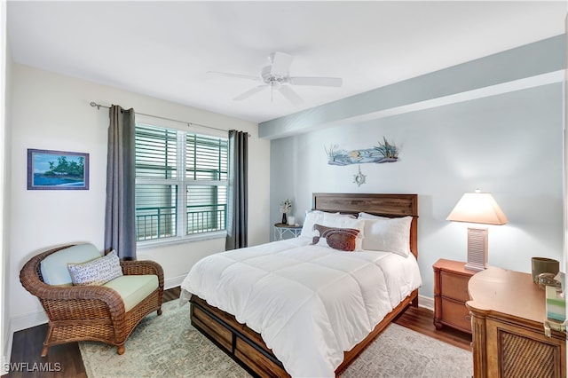 bedroom with ceiling fan and hardwood / wood-style floors