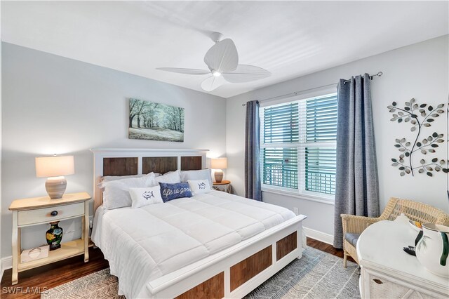 bedroom with ceiling fan and hardwood / wood-style floors