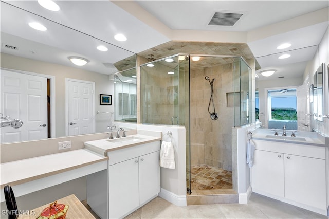 bathroom with vanity, tile patterned floors, and a shower with shower door