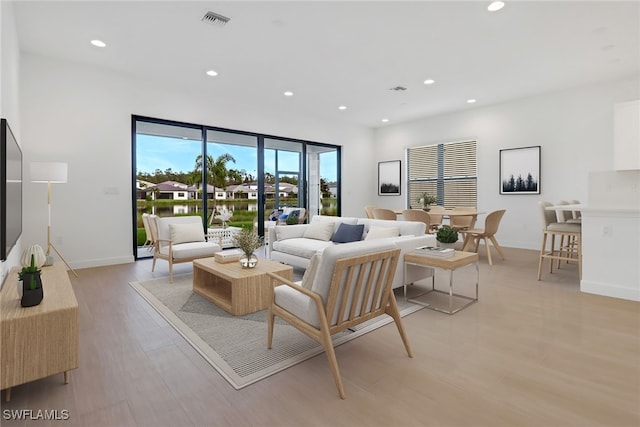 living room with light hardwood / wood-style floors