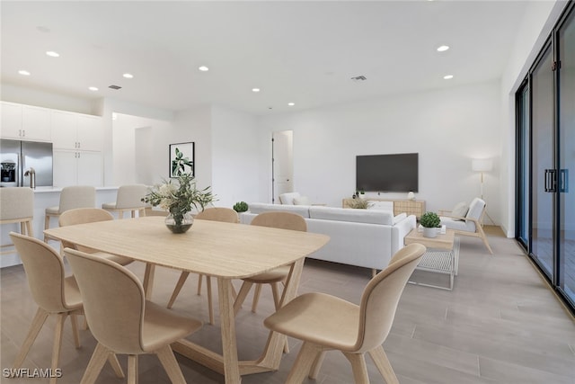 dining space featuring light hardwood / wood-style floors