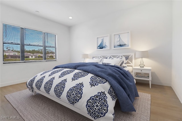 bedroom with light hardwood / wood-style floors