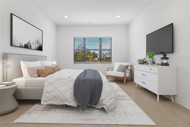 bedroom with light hardwood / wood-style floors