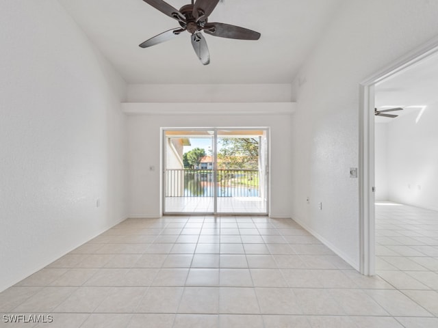 spare room featuring ceiling fan and light tile patterned floors