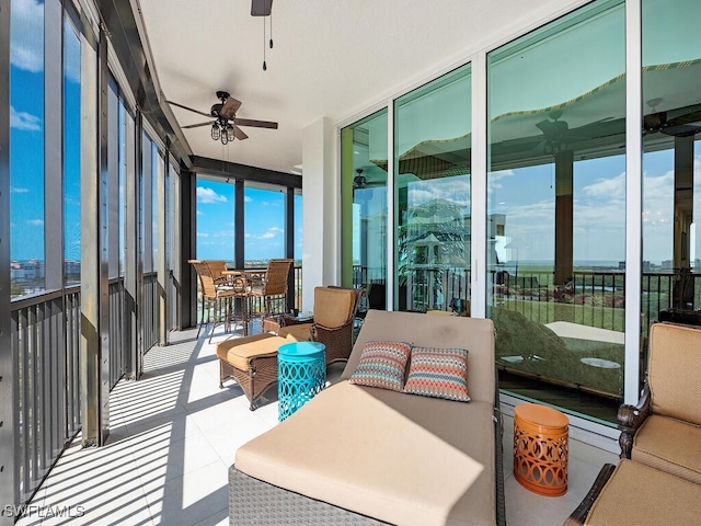 455 Cove Tower Dr Unit 1704, Naples, FL 34110 - sunroom / solarium with ceiling fan, floor to ceiling windows, outdoor dining space, and tile patterned floors