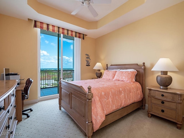 455 Cove Tower Dr Unit 1704, Naples, FL 34110 - bedroom with light colored carpet, access to exterior, an office area, and a tray ceiling