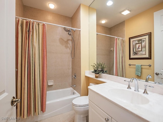 full bathroom with tile patterned flooring, vanity, toilet, and shower / bath combo with shower curtain