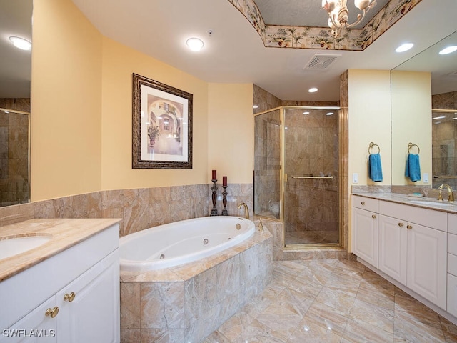 bathroom with vanity and independent shower and bath