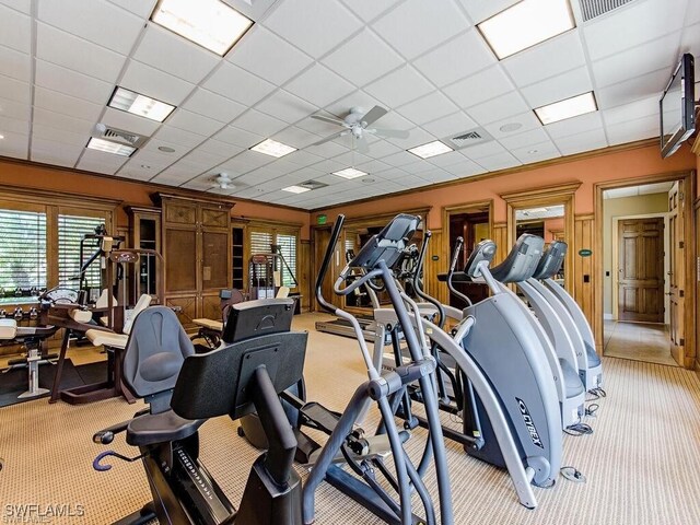 455 Cove Tower Dr Unit 1704, Naples, FL 34110 - workout area with light carpet, ceiling fan, healthy amount of natural light, and a drop ceiling