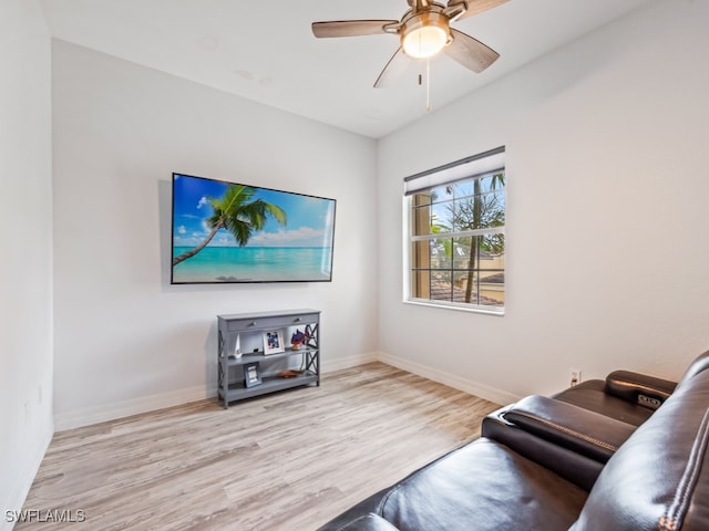 sitting room featuring light hardwood / wood-style floors and ceiling fan