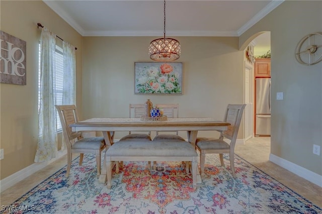 dining area featuring a notable chandelier and crown molding