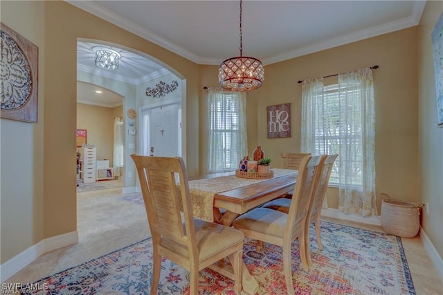 tiled dining room with an inviting chandelier and crown molding