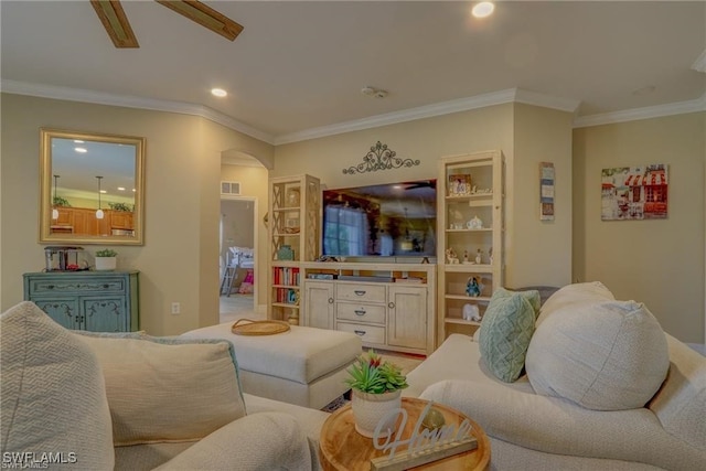 living room with crown molding and ceiling fan