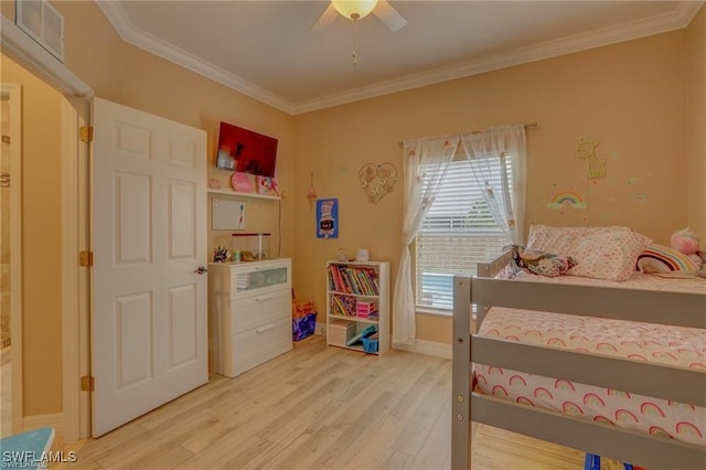 bedroom featuring crown molding, hardwood / wood-style floors, and ceiling fan