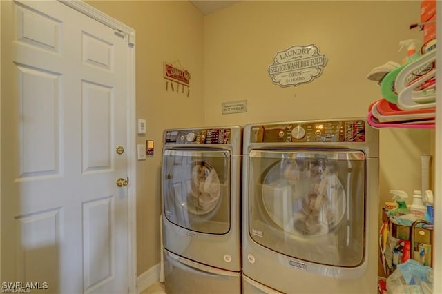 laundry room with separate washer and dryer