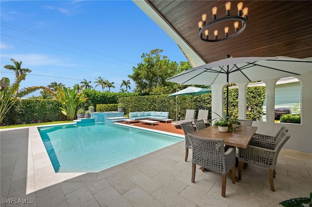 view of swimming pool with an outdoor living space and a patio area