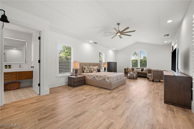 bedroom with ceiling fan, light hardwood / wood-style flooring, and multiple windows