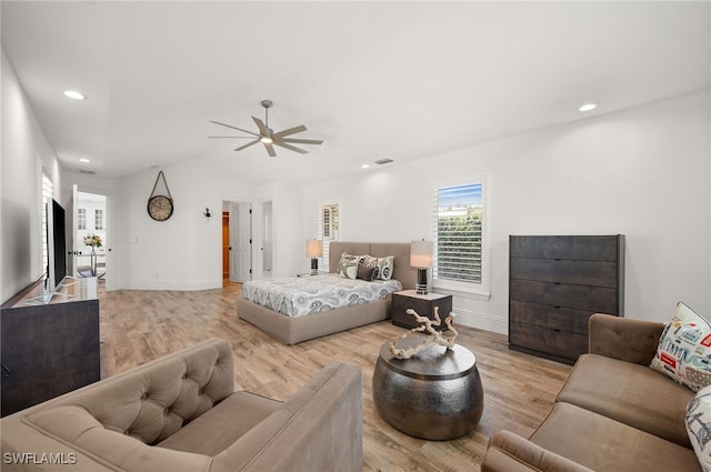 bedroom with ceiling fan and light hardwood / wood-style flooring