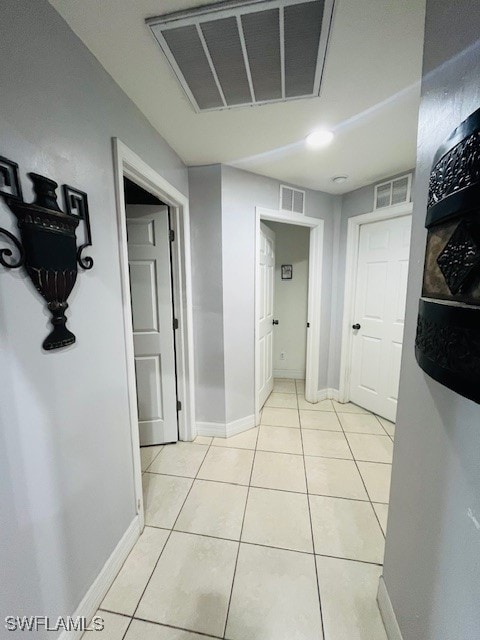 hallway featuring light tile patterned floors