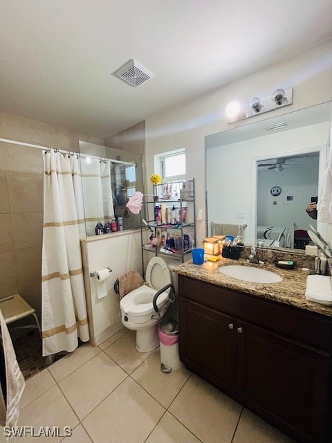 bathroom featuring ceiling fan, walk in shower, toilet, vanity, and tile patterned floors