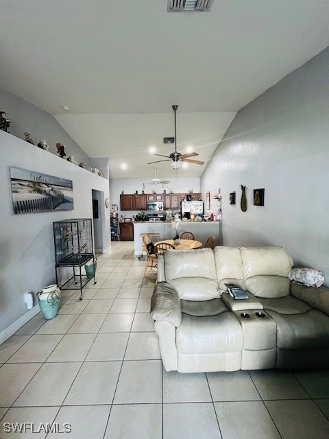 tiled living room with vaulted ceiling and ceiling fan