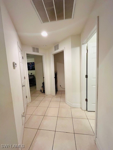 hall with light tile patterned flooring