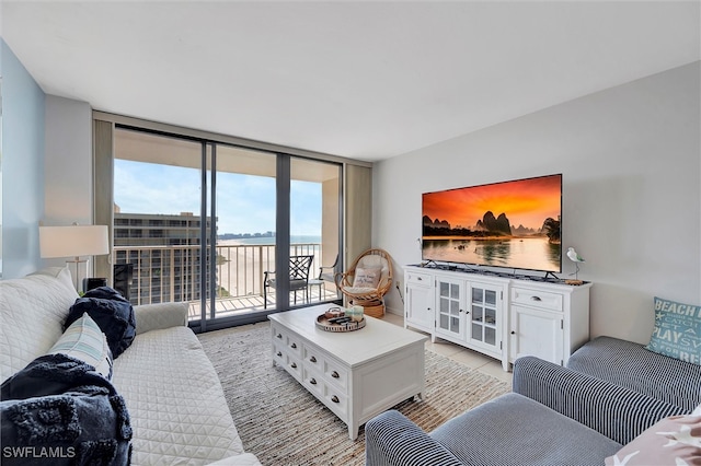 tiled living room featuring expansive windows