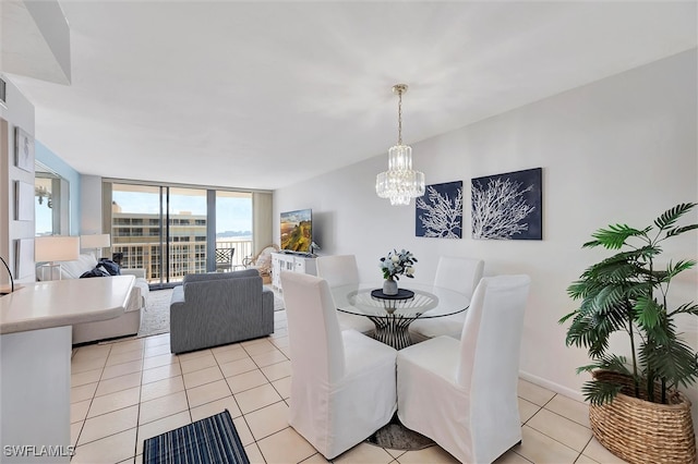 tiled dining space featuring an inviting chandelier and expansive windows