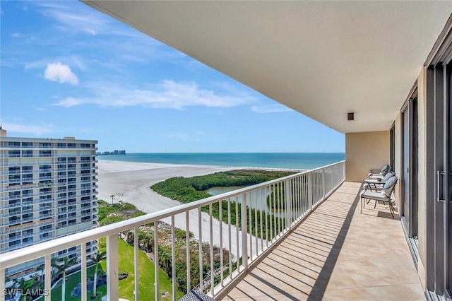 balcony with a view of the beach and a water view