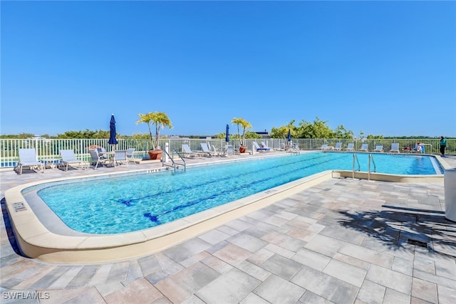 view of swimming pool featuring a patio