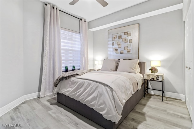 bedroom with ceiling fan and light hardwood / wood-style flooring