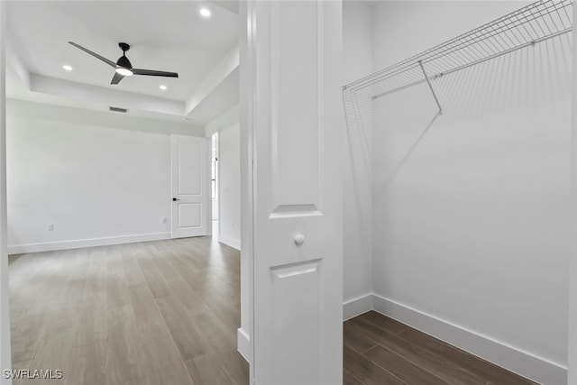 interior space with ceiling fan and hardwood / wood-style floors