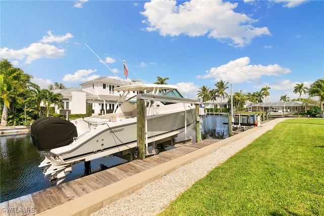 view of dock featuring a water view and a lawn