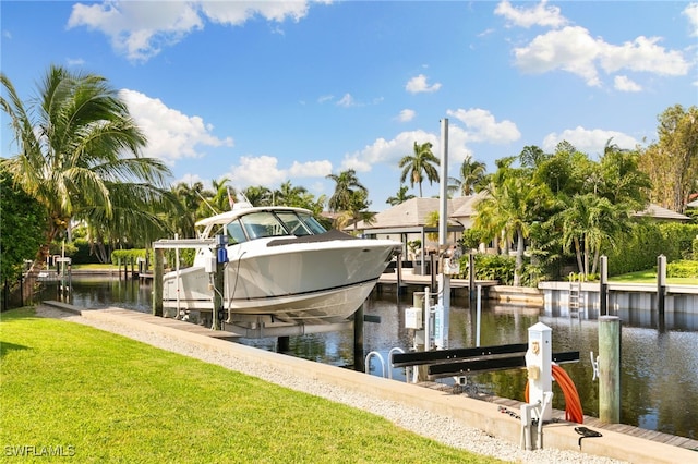 dock area featuring a water view and a yard