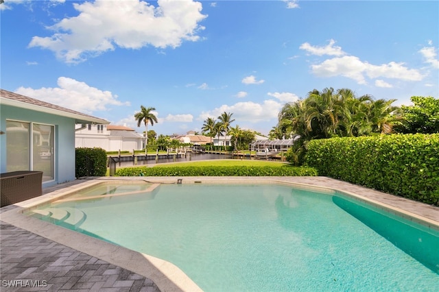 view of pool with a water view