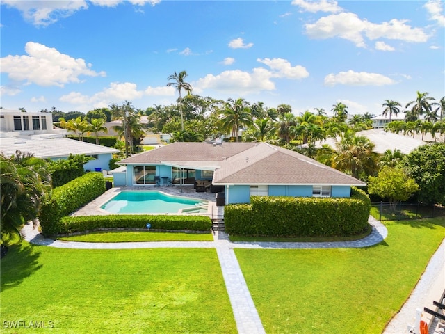 view of pool with a yard and a patio