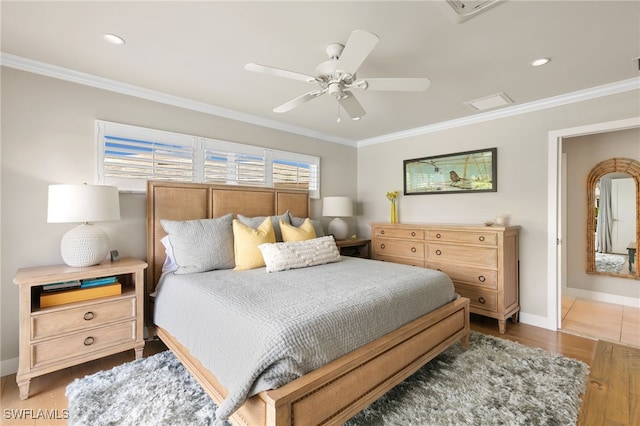 bedroom featuring dark hardwood / wood-style flooring, ceiling fan, and crown molding