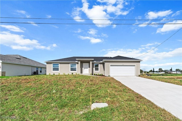 view of front of house featuring a front lawn, central AC unit, and a garage