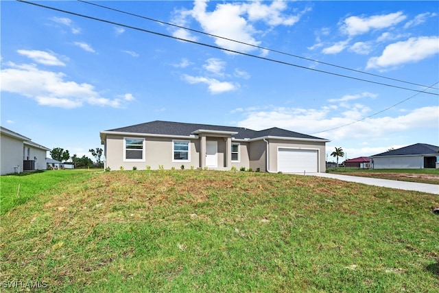 view of front facade with a garage and a front lawn