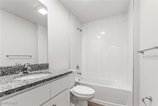 full bathroom featuring vanity, toilet, tiled shower / bath combo, and wood-type flooring