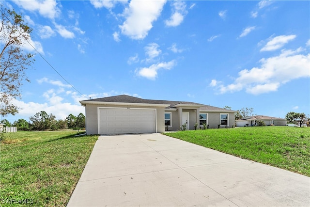 view of front of home featuring a front yard and a garage