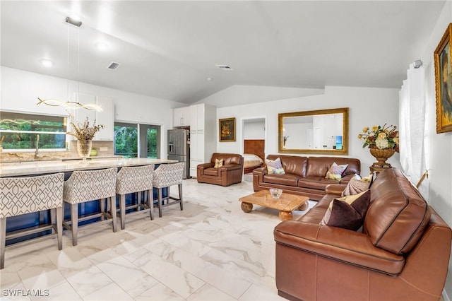 living room featuring lofted ceiling