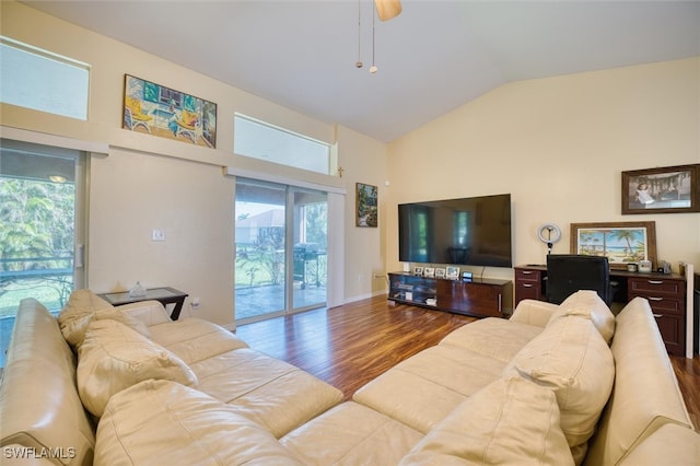 living room featuring vaulted ceiling and hardwood / wood-style floors