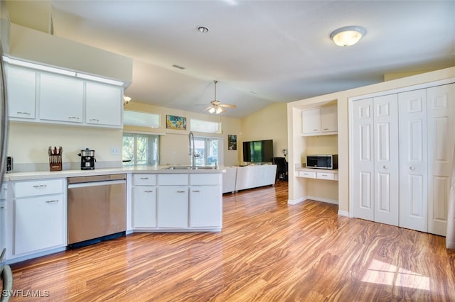 kitchen with white cabinetry, ceiling fan, and stainless steel appliances