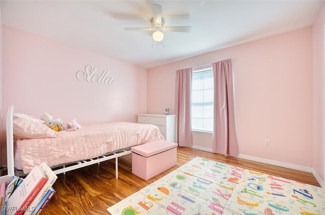 bedroom with wood-type flooring and ceiling fan