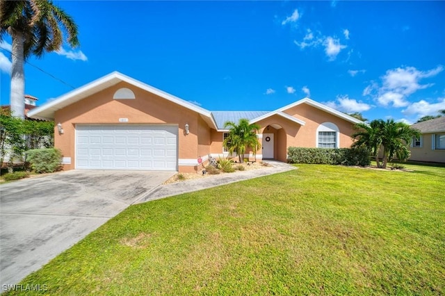 ranch-style house featuring a garage and a front lawn